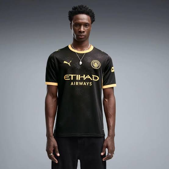 Manchester City black and gold Puma jersey